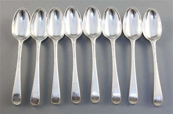 A set of eight George III silver feather edge pattern dessert spoons, 10.1oz